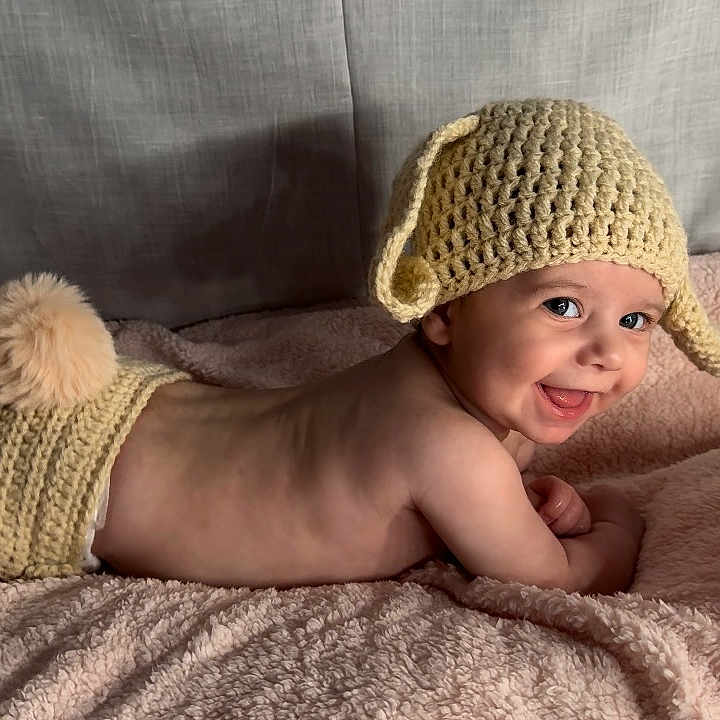 Alora-Faith joined the competition — help win amazing prizes! baby, beanie, bed, blanket, bodypart, bonnet, cap, clothing, cushion, face, furniture, happy, hat, head, homedecor, newborn, person, photography, portrait, smile