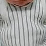 baby, infant, face, clothing, striped, serious_expression, close_up, newborn, child, person, portrait, indoor, young, cute, skin, head, small, baby_clothes, human, expression