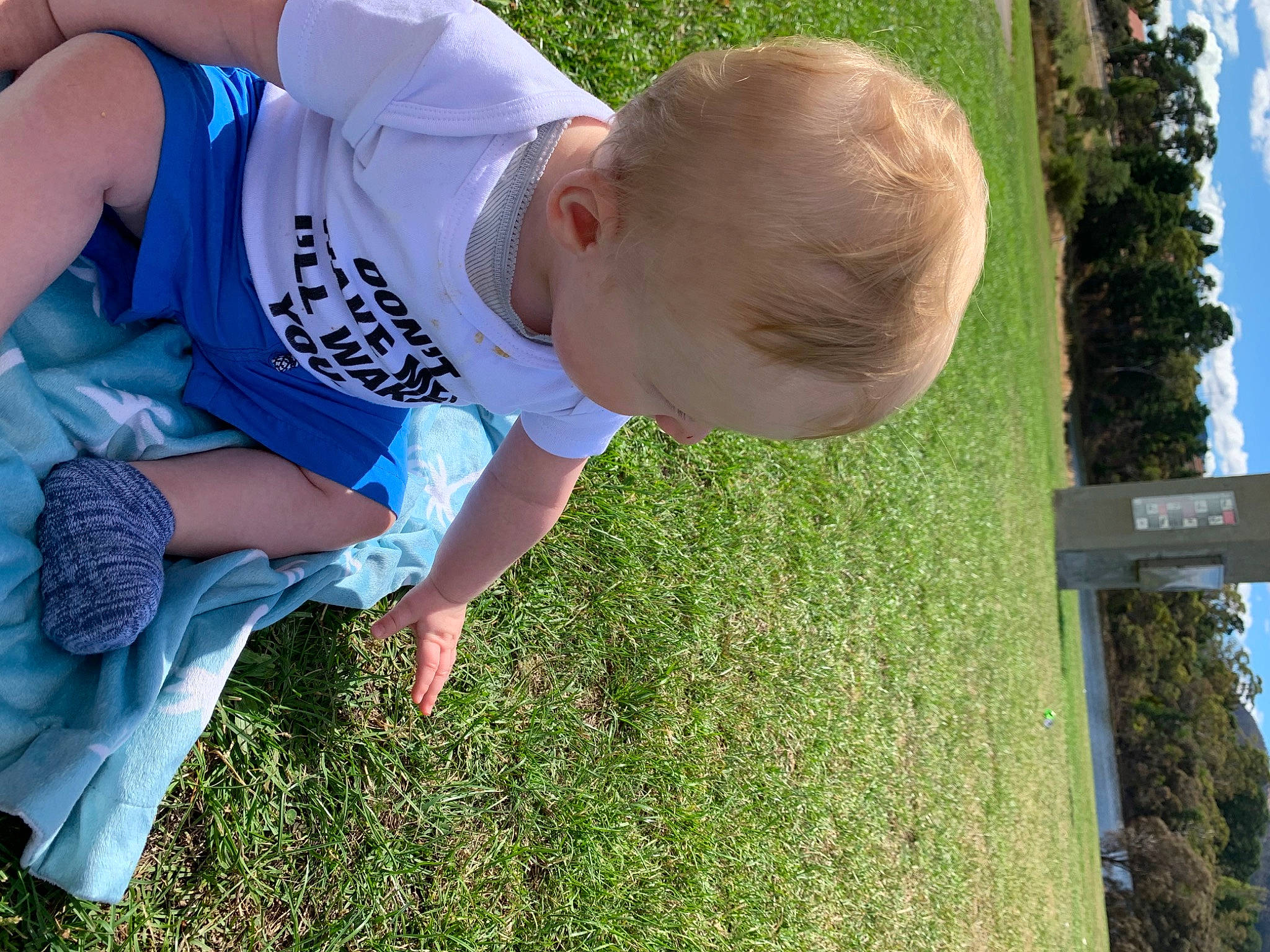 Kaden is registered to the contest to win money with this photo: baby_toddler_clothing, barefoot, botany, child, electric_blue, fun, gesture, grass, grass_family, green, happy, lawn, leg, leisure, people_in_nature, person, plant, play, shorts, t_shirt