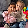 Juna participe au concours pour gagner de l'argent avec cette photo : toddler, child, hug, indoor, toy, playmat, smile, curly_hair, jeans, sneakers, pink_sweater, mickey_mouse, floor, furniture, colorful, friendship, candid, cute, happy, portrait