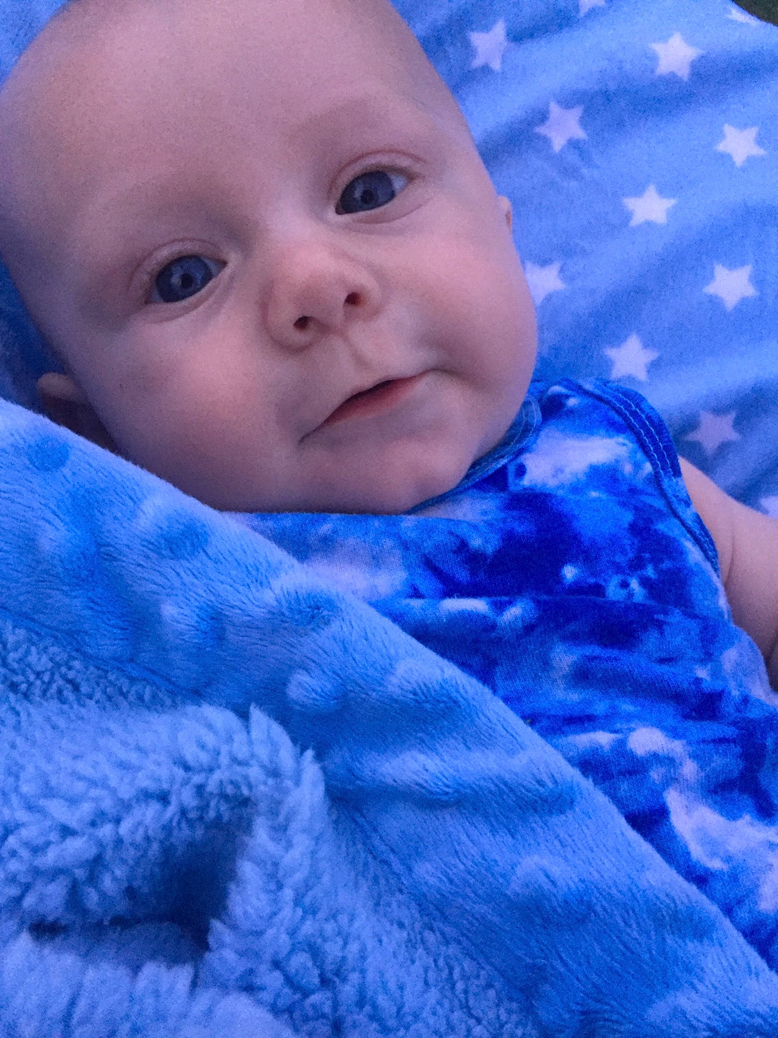 Maxwell is registered to the contest to win money with this photo: azure, baby, baby_toddler_clothing, blue, cheek, chin, eye, eyebrow, face, finger, iris, lip, nose, person, pink, purple, skin, sleeve, smile, textile