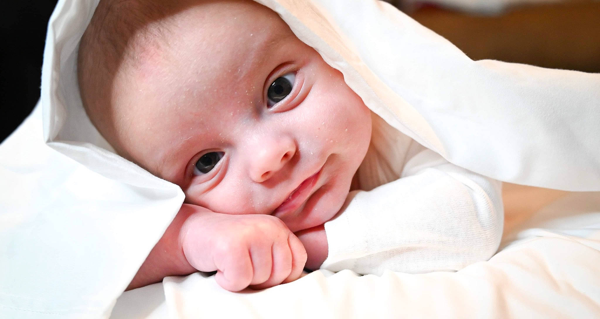 Dayton is registered to the contest to win money with this photo: baby, baby_toddler_clothing, cheek, child, comfort, dress, eyebrow, eyelash, gesture, happy, hat, iris, lip, nose, person, portrait_photography, skin, sleeve, smile, thumb