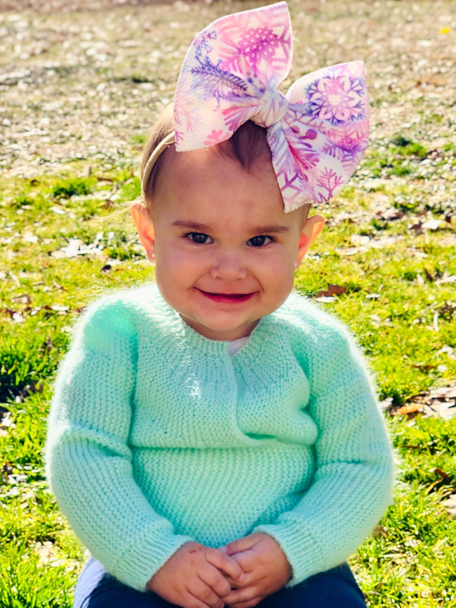 Lillia is registered to the contest to win money with this photo: baby, baby_toddler_clothing, cap, clothing, costume_hat, face, grass, happy, hat, head, headgear, headpiece, headwear, joy, magenta, people_in_nature, person, photograph, pink, sleeve