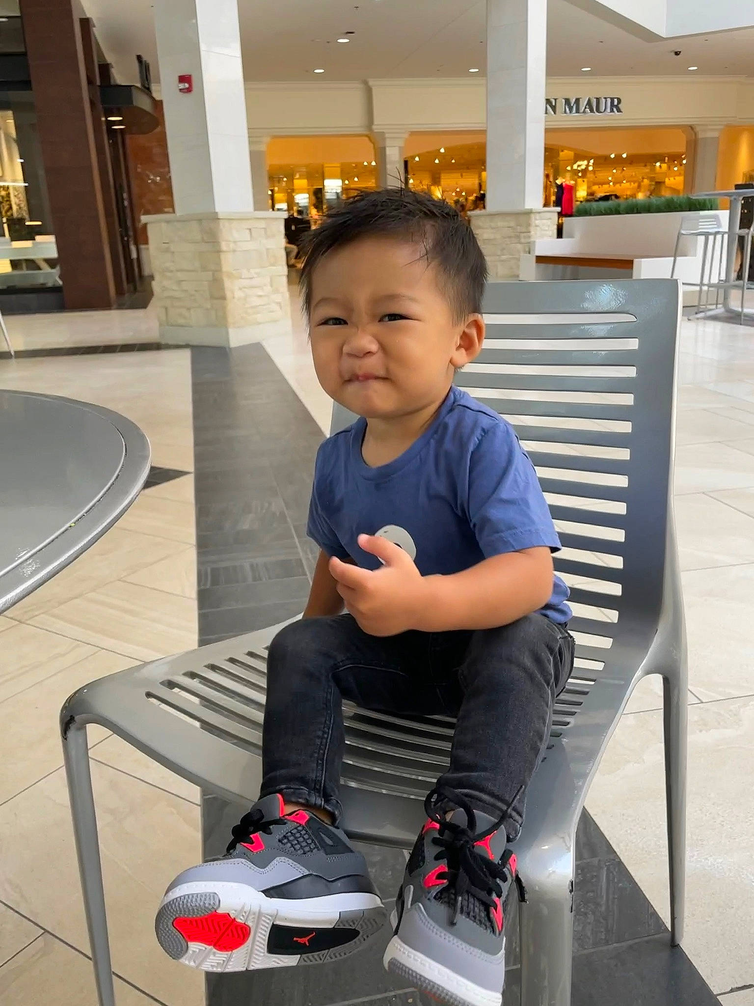 Christansen joined the competition — help win amazing prizes! baby_toddler_clothing, carmine, child, cleanliness, composite_material, floor, flooring, fun, human_leg, knee, leisure, person, product, room, sitting, smile, standing, t_shirt, toddler, travel