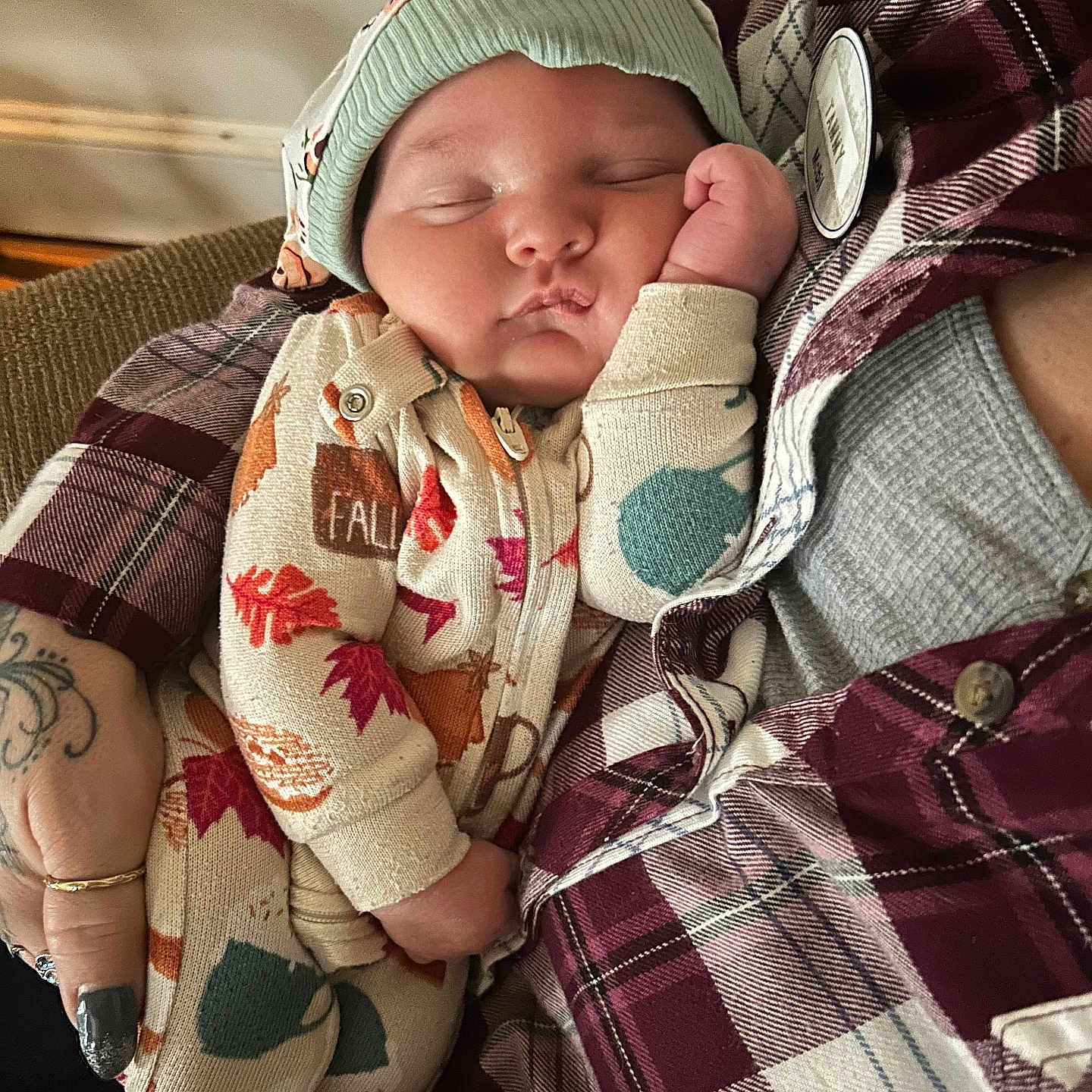 Lennon joined the competition — help win amazing prizes! baby, beanie, blanket, bonnet, cap, clothing, couch, face, furniture, glove, hat, head, knitwear, newborn, person, photography, portrait, skin, sweater, tattoo