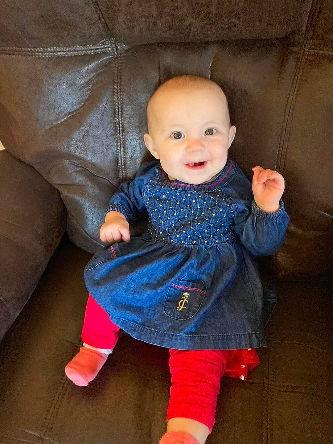 Freya is registered to the contest to win money with this photo: baby, baby_toddler_clothing, cheek, chin, comfort, dress, eye, face, facial_expression, finger, hand, head, iris, joy, outerwear, person, pink, skin, sleeve, smile