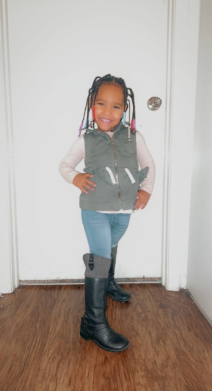 Kyleigh is registered to the contest to win money with this photo: baby_toddler_clothing, denim, electric_blue, floor, flooring, hair, hardwood, human_body, human_leg, joy, knee, leg, pattern, person, sleeve, smile, street_fashion, t_shirt, thigh, toddler