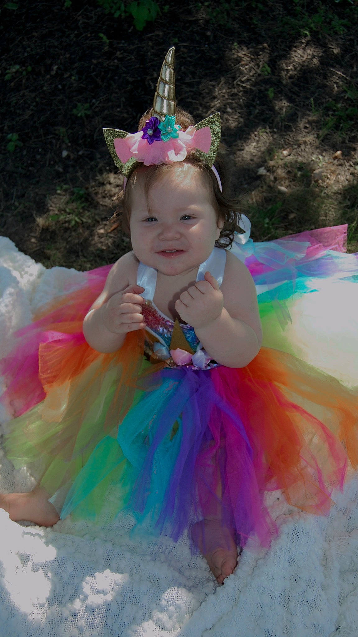 Gianna joined the competition — help win amazing prizes! baby_toddler_clothing, beauty, costume, costume_hat, event, fun, grass, happy, headgear, headpiece, magenta, mythical_creature, party_hat, party_supply, person, pink, purple, recreation, smile, toddler