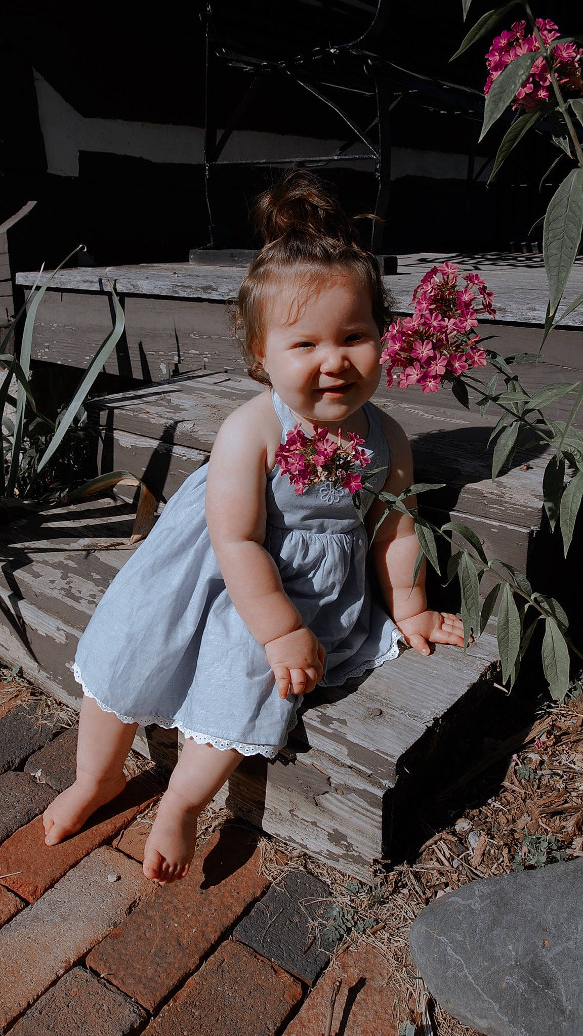 Gianna joined the competition — help win amazing prizes! child, dress, event, flower, foot, fun, grass, hairstyle, happy, human, human_leg, leisure, person, pink, plant, public_space, sandal, sitting, smile, summer