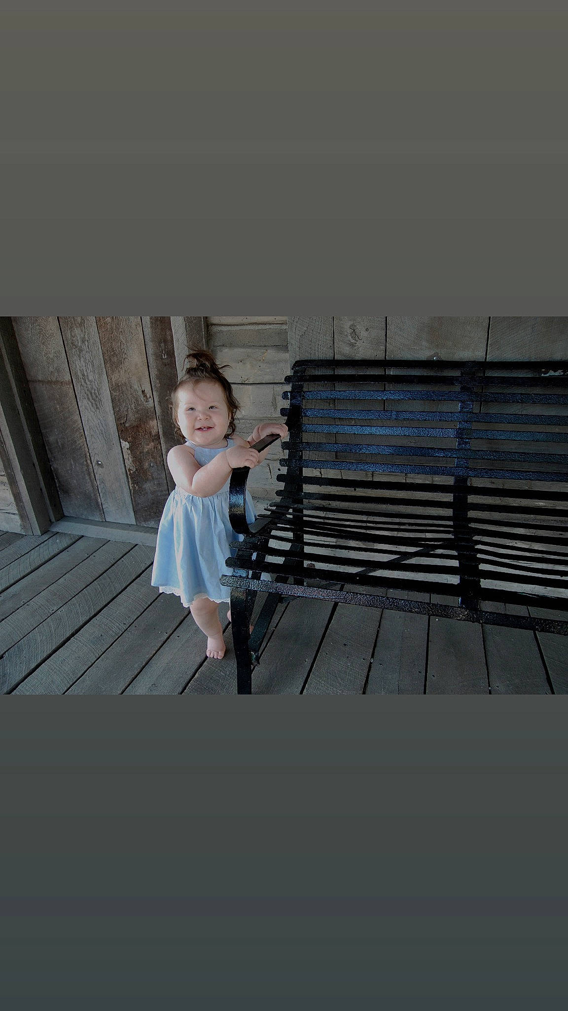 Gianna joined the competition — help win amazing prizes! bench, composite_material, denim, electric_blue, flash_photography, flooring, grey, hairstyle, happy, joy, outdoor_bench, outdoor_furniture, pattern, person, shoulder, sitting, sleeve, smile, t_shirt, toddler