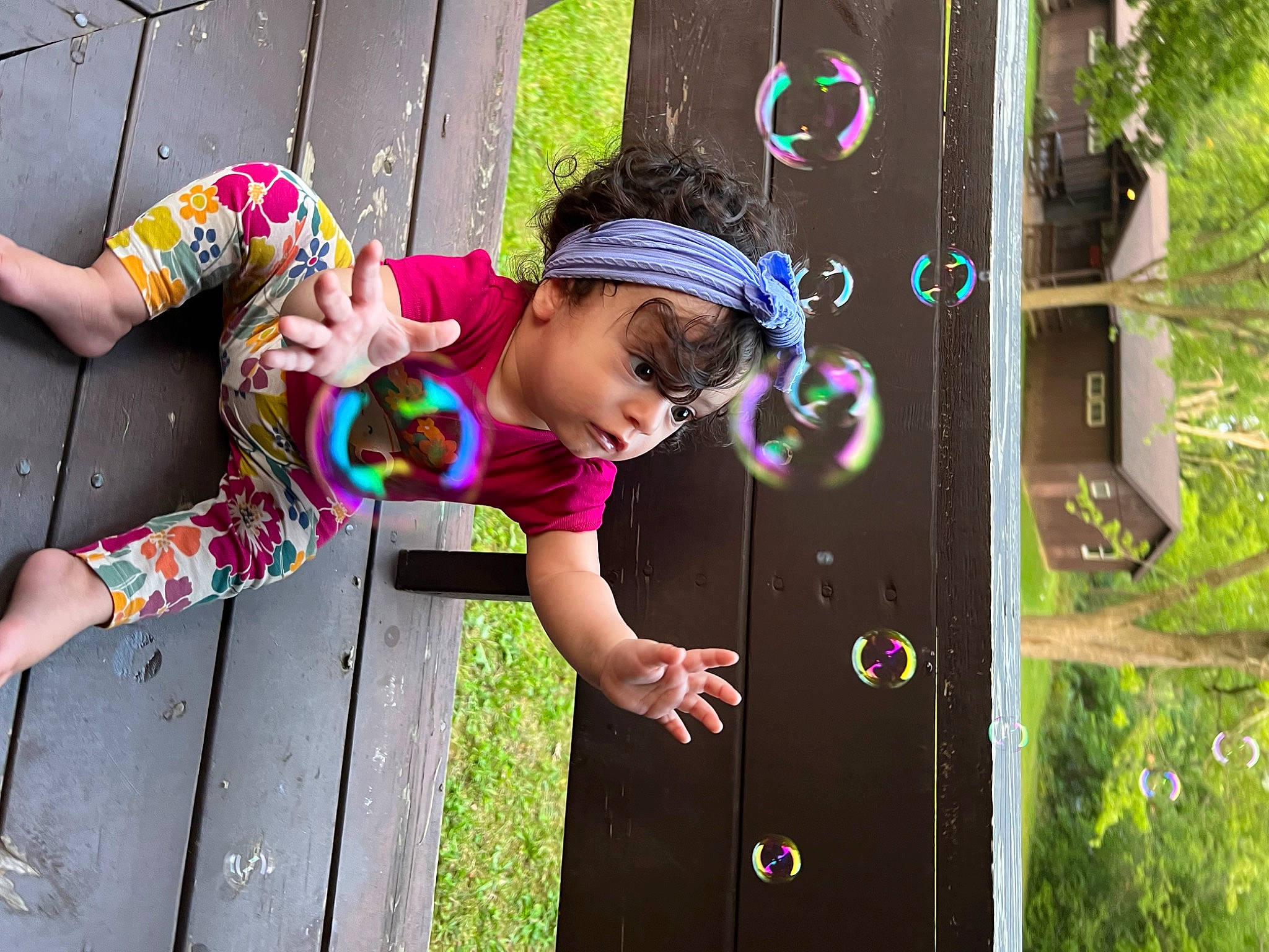 Mia is registered to the contest to win money with this photo: baby_toddler_clothing, child, door, fun, grass, happy, hat, headwear, leaf, leisure, magenta, person, pink, plant, play, public_space, purple, recreation, shorts, spring