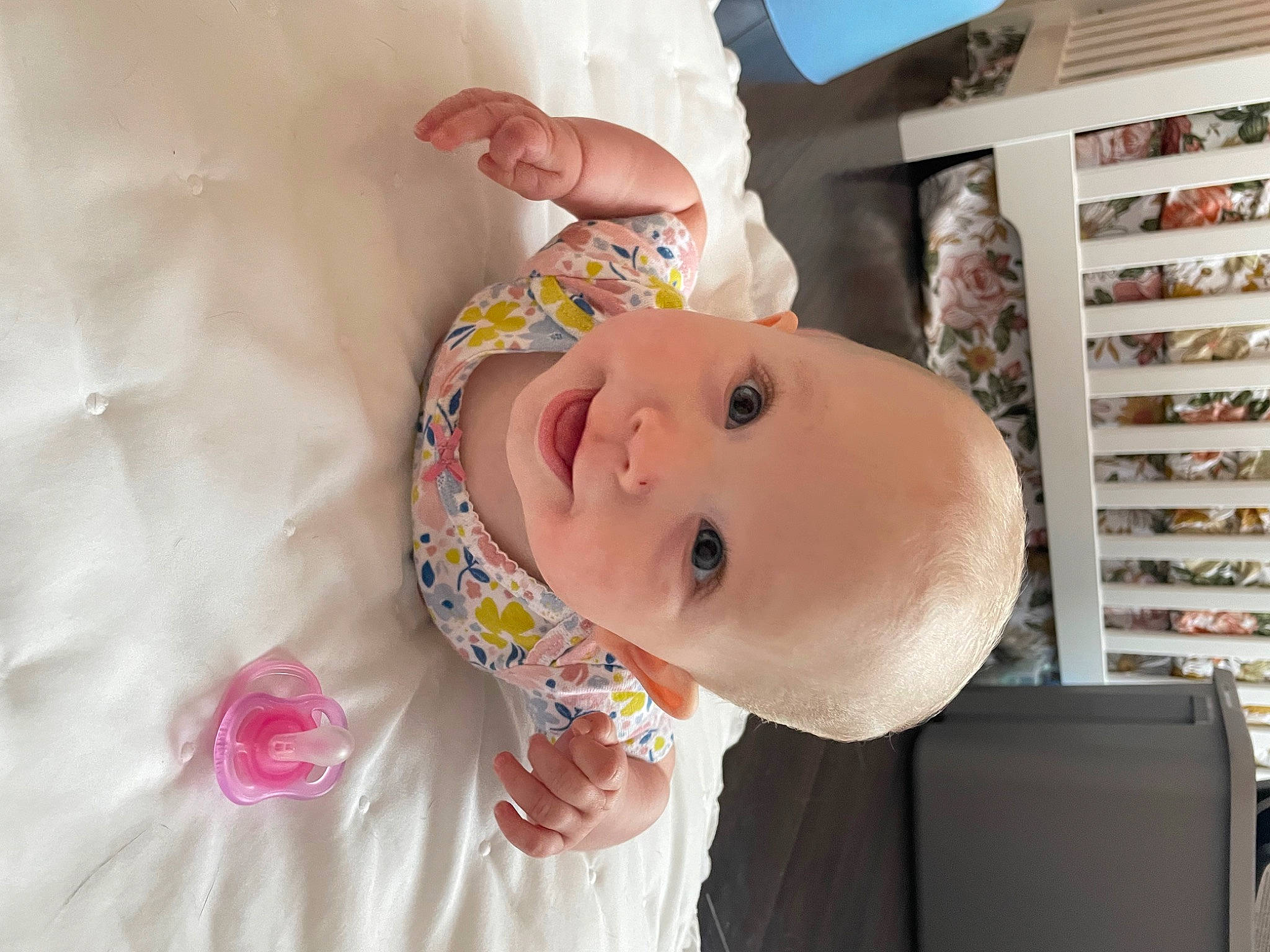 Hadley is registered to the contest to win money with this photo: baby, baby_products, baby_safety, baby_toddler_clothing, cheek, child, chin, comfort, happy, hat, human_body, iris, lip, nose, person, pink, shelf, skin, smile, textile