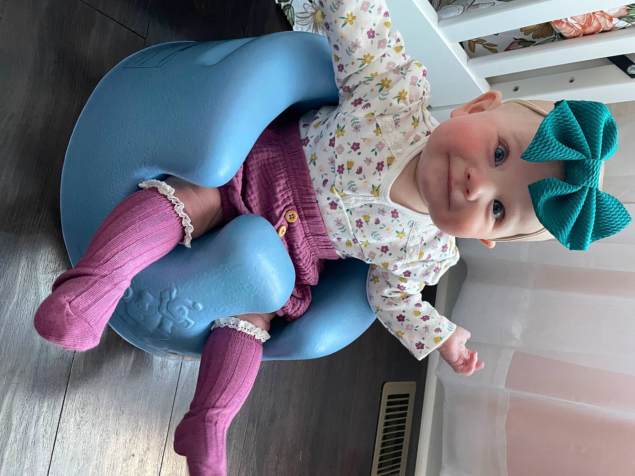 Hadley is registered to the contest to win money with this photo: baby, baby_products, baby_toddler_clothing, comfort, cool, facial_expression, fun, hat, headgear, headwear, human_leg, joint, joy, knee, magenta, pattern, person, pink, purple, sun_hat