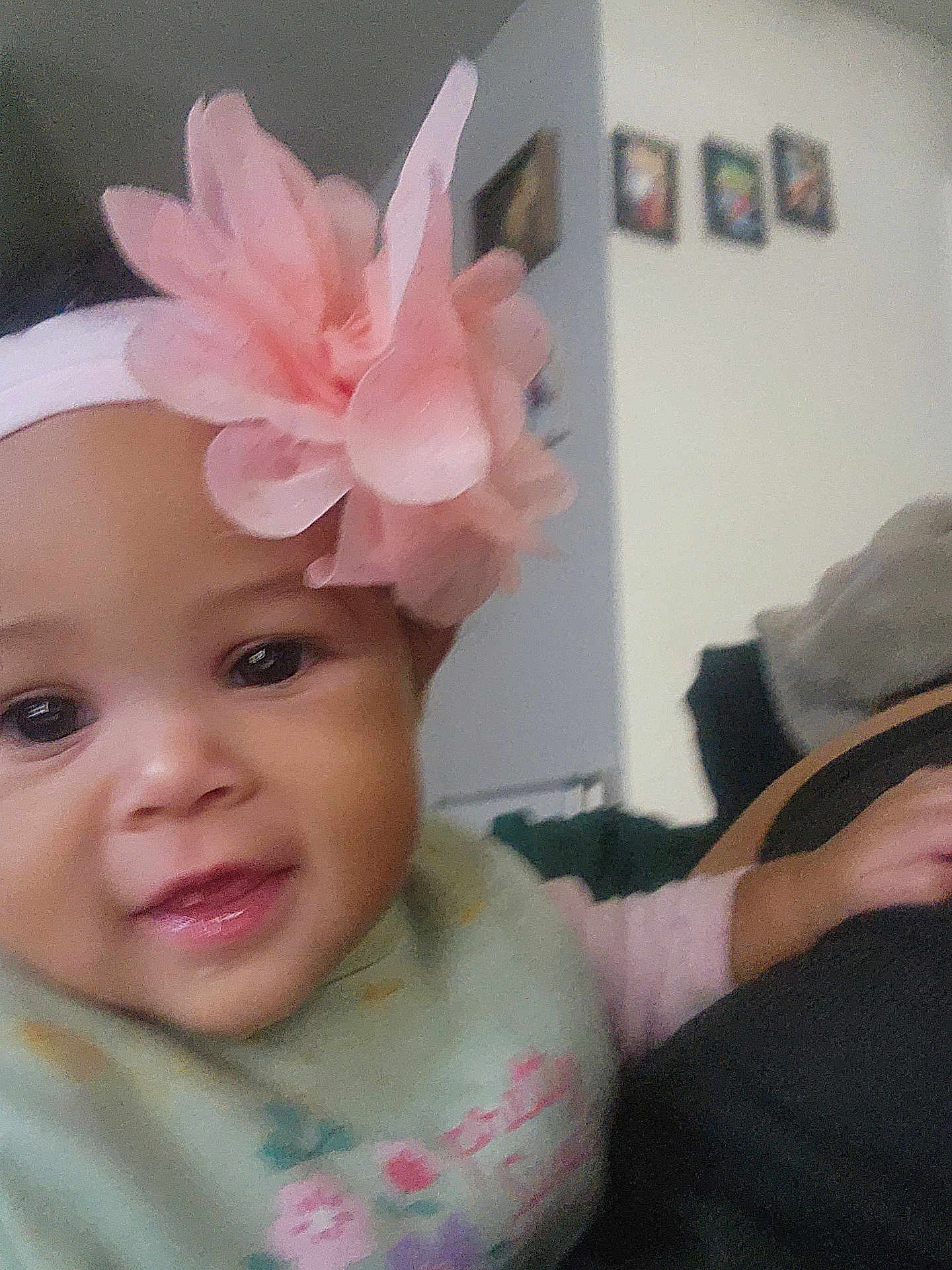 Paulaina is registered to the contest to win money with this photo: baby, child, headband, flower, pink, smile, face, indoors, clothing, person, portrait, cute, young, infant, hand, apparel, wall, decoration, blurred_background, happy