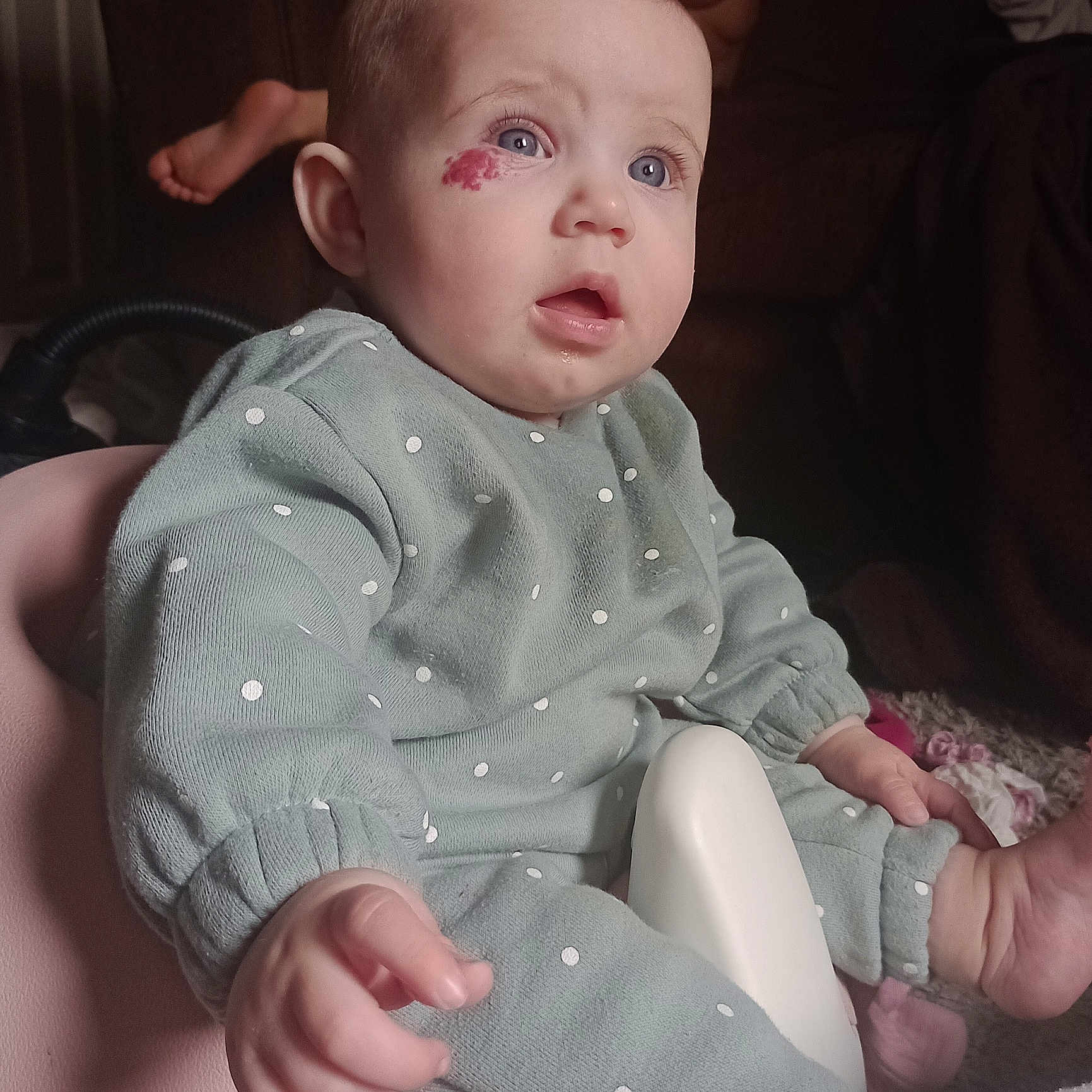 Bella joined the competition — help win amazing prizes! baby, birthmark, blue_eyes, child, clothing, couch, curious, face, foot, hand, indoor, infant, mint_green, person, pink, polka_dot, seat, sitting, soft_lighting, toy