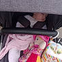 baby, stroller, sleeping, doll, blanket, toy, child, infant, fabric, pink, clothing, seatbelt, head, face, person, comfort, cute, rest, soft, indoor