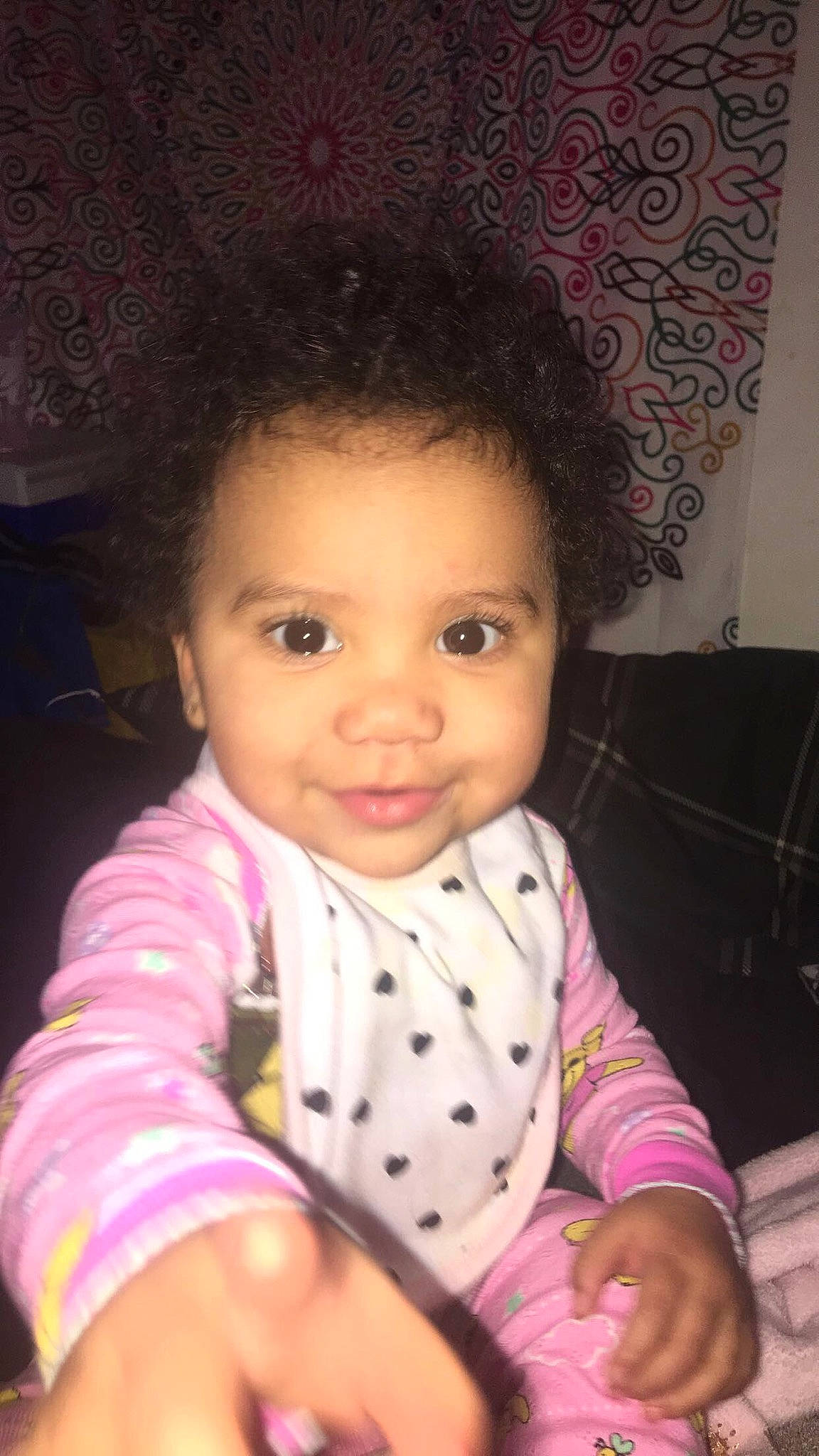 Kendall Lee is registered to the contest to win money with this photo: baby, black_hair, cheek, child, chin, eye, eyebrow, face, forehead, hair, head, iris, lip, mouth, nose, person, pink, sitting, skin, smile