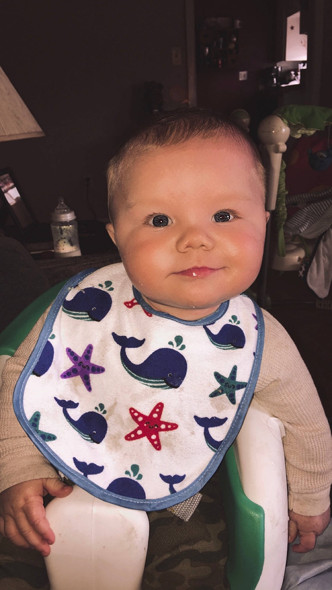 Konnor is registered to the contest to win money with this photo: baby, bib, cheek, child, face, head, person, toddler