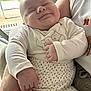 Aaron a rejoint le concours — aidez-le/la à gagner de superbes lots ! arm, baby, clothing, cozy, cute, face, greenery, hand, happy, holding, indoor, infant, patterned_pants, person, portrait, sleeping, smiling, soft_light, white_shirt, window