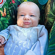 Aaron participe au concours pour gagner de l'argent avec cette photo : baby, blue_eyes, child, close_up, clothing, cozy, cute, drool, fox_design, greenery, happy, indoors, infant, patterned_background, portrait, seat, smile, soft_lighting, sweet_dream, toddler