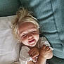 Andréa-Jade joined the competition — help win amazing prizes! toddler, child, smiling, blonde_hair, white_shirt, purple_shorts, couch, pillow, blanket, happy, indoor, cute, person, portrait, relaxed, comfort, baby, closeup, arms_crossed, tooth