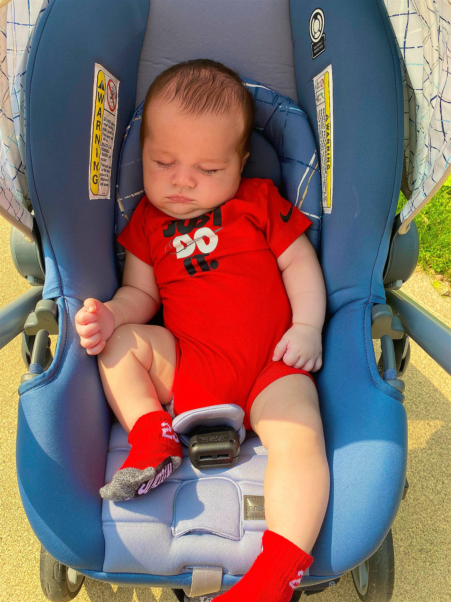 Lliam is registered to the contest to win money with this photo: automotive_design, baby, baby_products, baby_toddler_clothing, blue, chair, comfort, electric_blue, fun, lap, leisure, person, photograph, plant, product, recreation, sitting, thigh, toddler, wheel