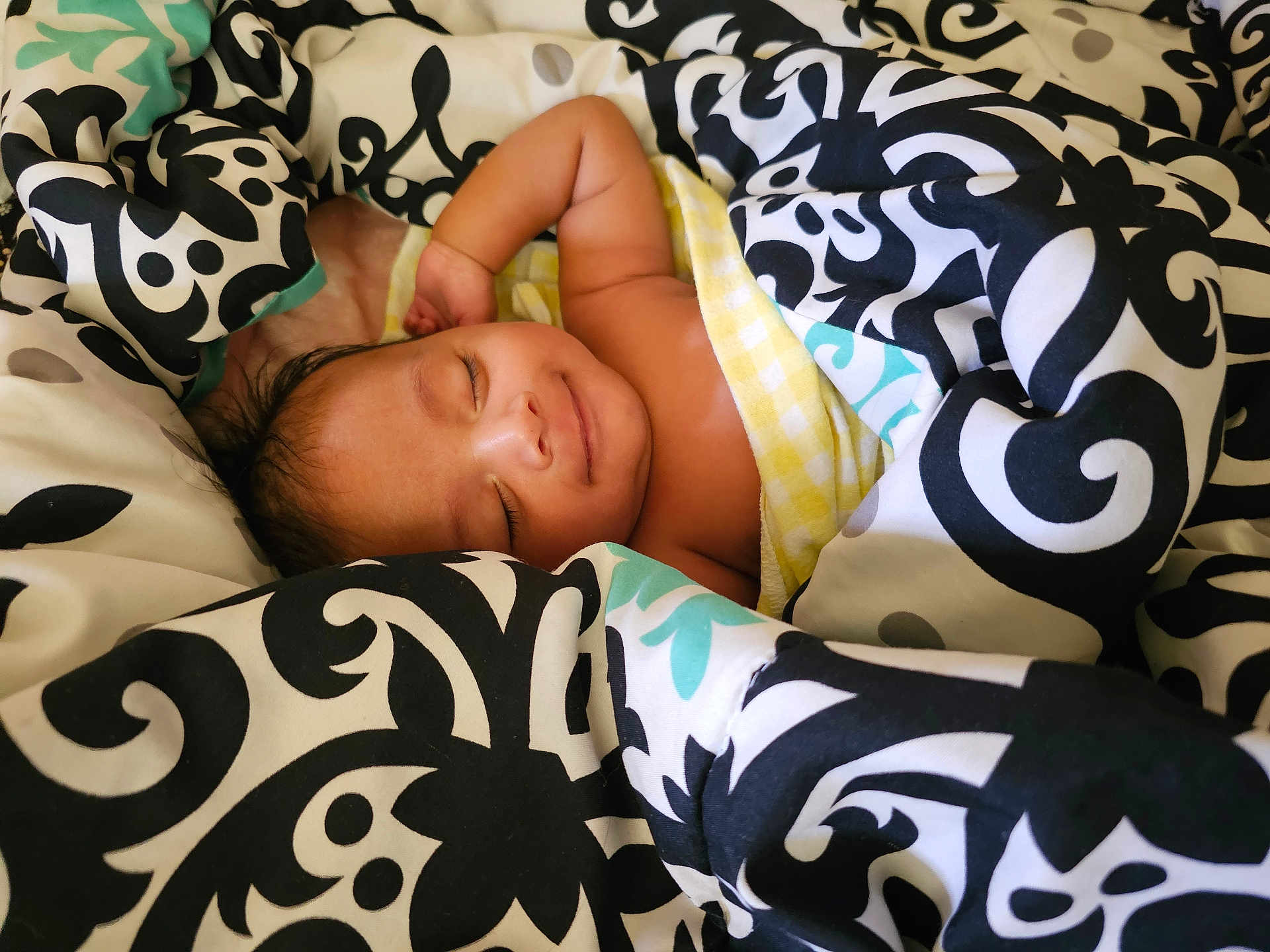 Aarthik joined the competition — help win amazing prizes! baby, sleeping, blanket, patterned_blanket, cozy, smile, child, infant, resting, cute, wrapped, soft, comfort, indoor, peaceful, portrait, human, skin, head, relaxation