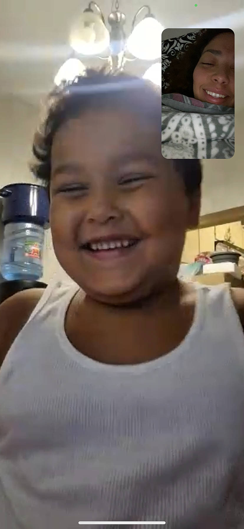 Landon is registered to the contest to win money with this photo: bottled_water, cheek, child, drinking_water, ear, eyebrow, eyelash, forehead, fun, hairstyle, happy, head, joy, muscle, person, plastic_bottle, skin, smile, t_shirt, tin_can