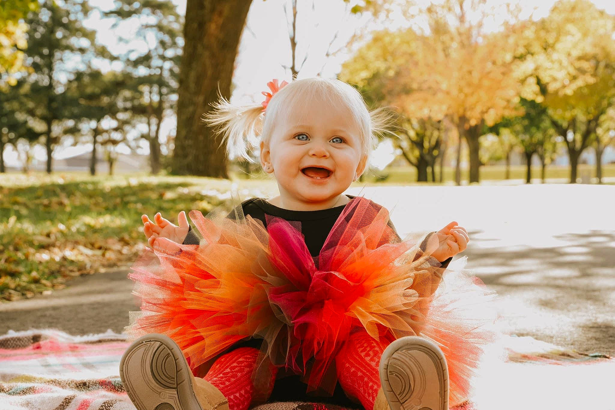 Brylie joined the competition — help win amazing prizes! baby, clothing, dress, eye, face, flower, grass, happy, head, iris, jacket, joy, orange, people_in_nature, person, petal, plant, smile, summer, sunlight