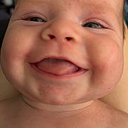 Brooks joined the competition — help win amazing prizes! baby, close_up, smiling, tongue_out, chubby_cheeks, face, skin, head, infant, portrait, happy, cute, child, human, expression, eyes, mouth, indoors, blurred_background, skin_texture