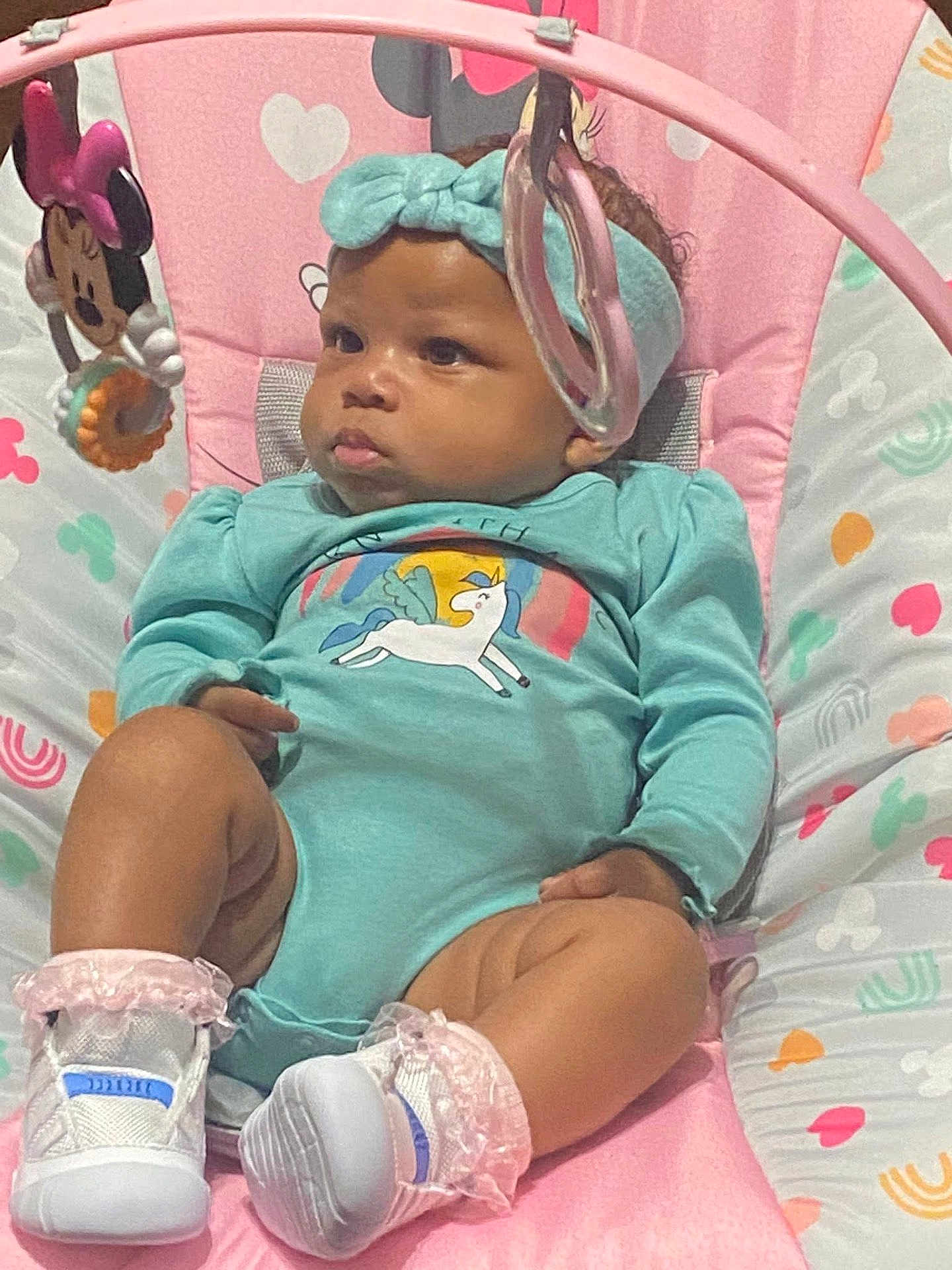 Amillion joined the competition — help win amazing prizes! baby, infant, onesie, headband, baby_seat, toy, minnie_mouse, pink, turquoise, unicorn, shoes, cute, child, indoors, patterned, sitting, playtime, curious, soft_toys, footwear
