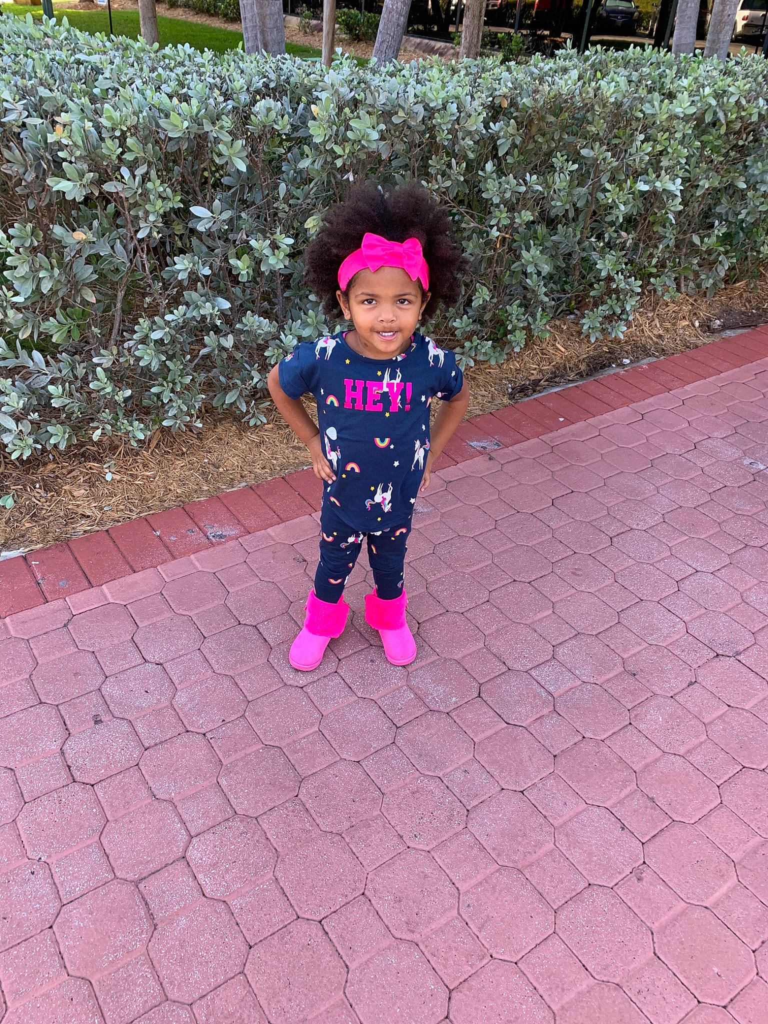 Lovely is registered to the contest to win money with this photo: car, child, flower, footwear, grass, joy, leisure, magenta, person, pink, plant, play, recreation, shoe, t_shirt, toddler, tree, vacation