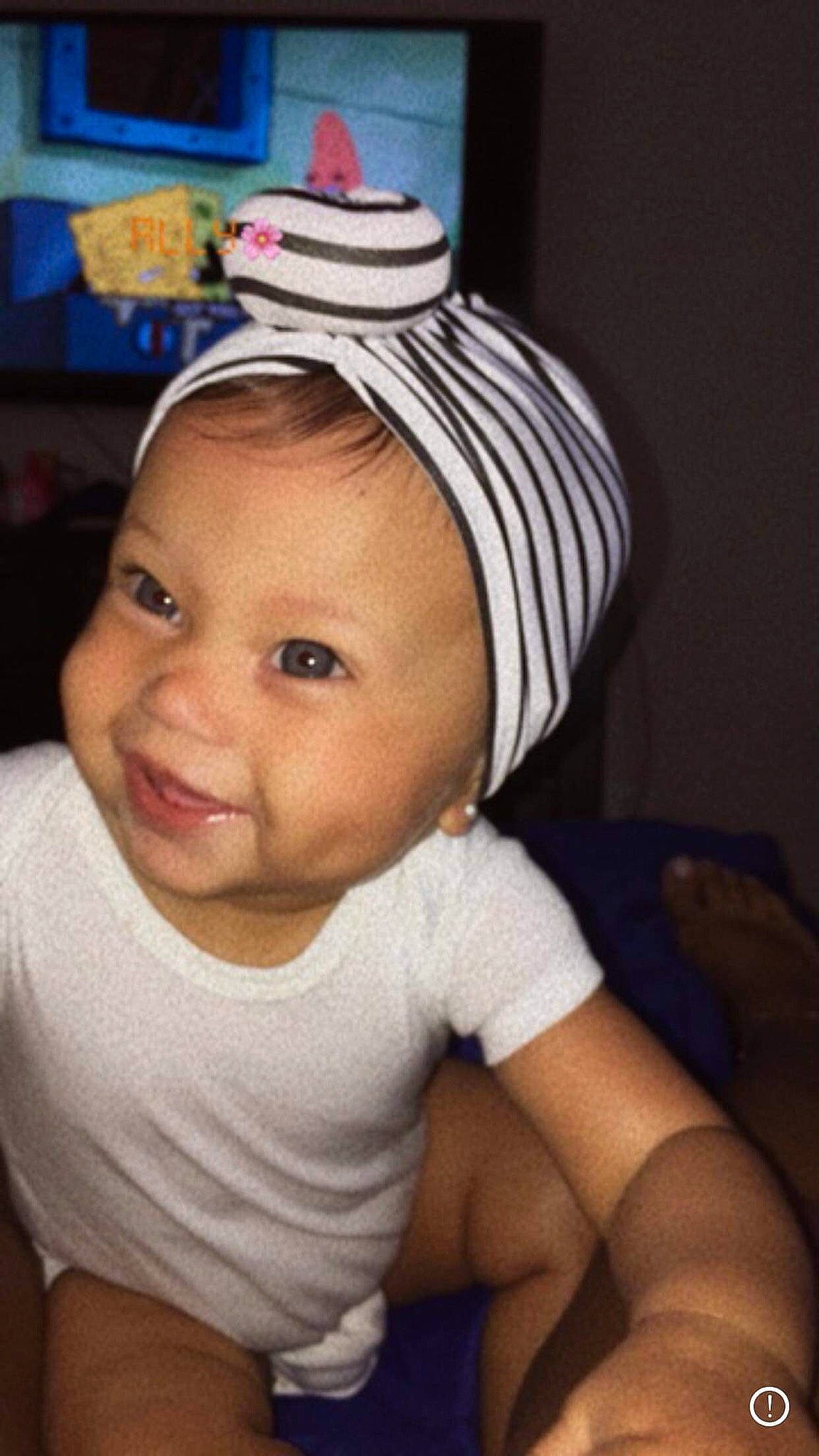 Jaliyah is registered to the contest to win money with this photo: baby, baby_toddler_clothing, cap, cheek, clothing, ear, eye, eyebrow, eyelash, flash_photography, happy, headgear, headwear, human_body, iris, joy, lip, mouth, nose, person