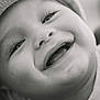 baby, black_and_white, cheeks, child, close_up, cute, emotion, expression, eyelashes, face, happy, hat, infant, joy, knit_hat, mouth, portrait, skin, smiling, soft_light