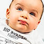 baby, baby_fashion, blue_eyes, cartoon, child, close_up, clothing, cute, expression, face, hair, head, infant, person, portrait, shirt, skin, smile, white_background, young