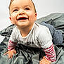 Maël participe au concours pour gagner de l'argent avec cette photo : baby, blanket, child, closeup, clothing, crawling, cute, face, gray_blanket, hands, happy, indoor, infant, playful, portrait, smiling, soft_texture, striped_sleeves, toddler, young_child