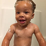 Jayceon is registered to the contest to win money with this photo: bathing, bathtub, boy, chest, child, close_up, face, forehead, infant, mouth, muscle, washing