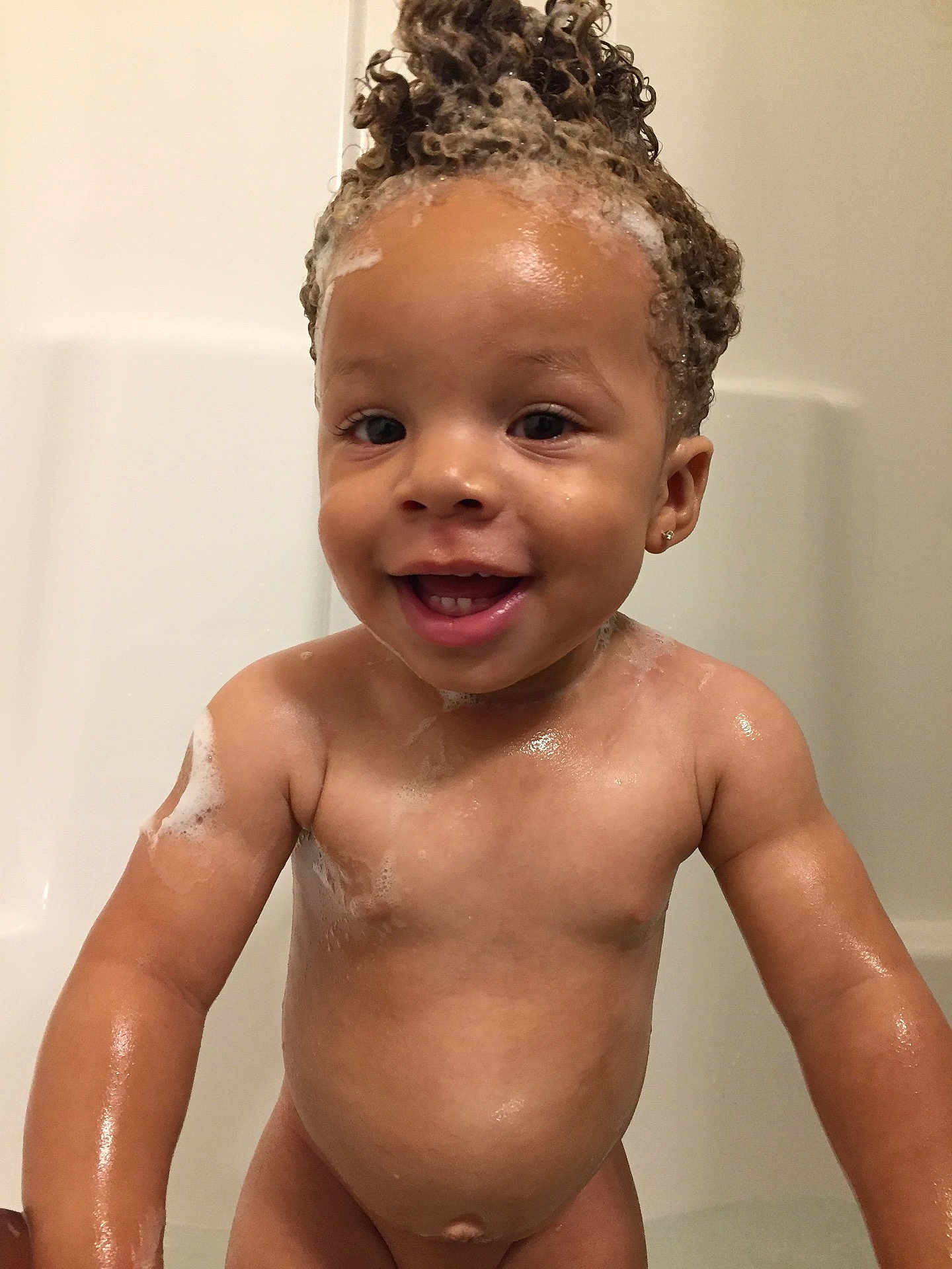 Jayceon is registered to the contest to win money with this photo: bathing, bathtub, boy, chest, child, close_up, face, forehead, infant, mouth, muscle, washing