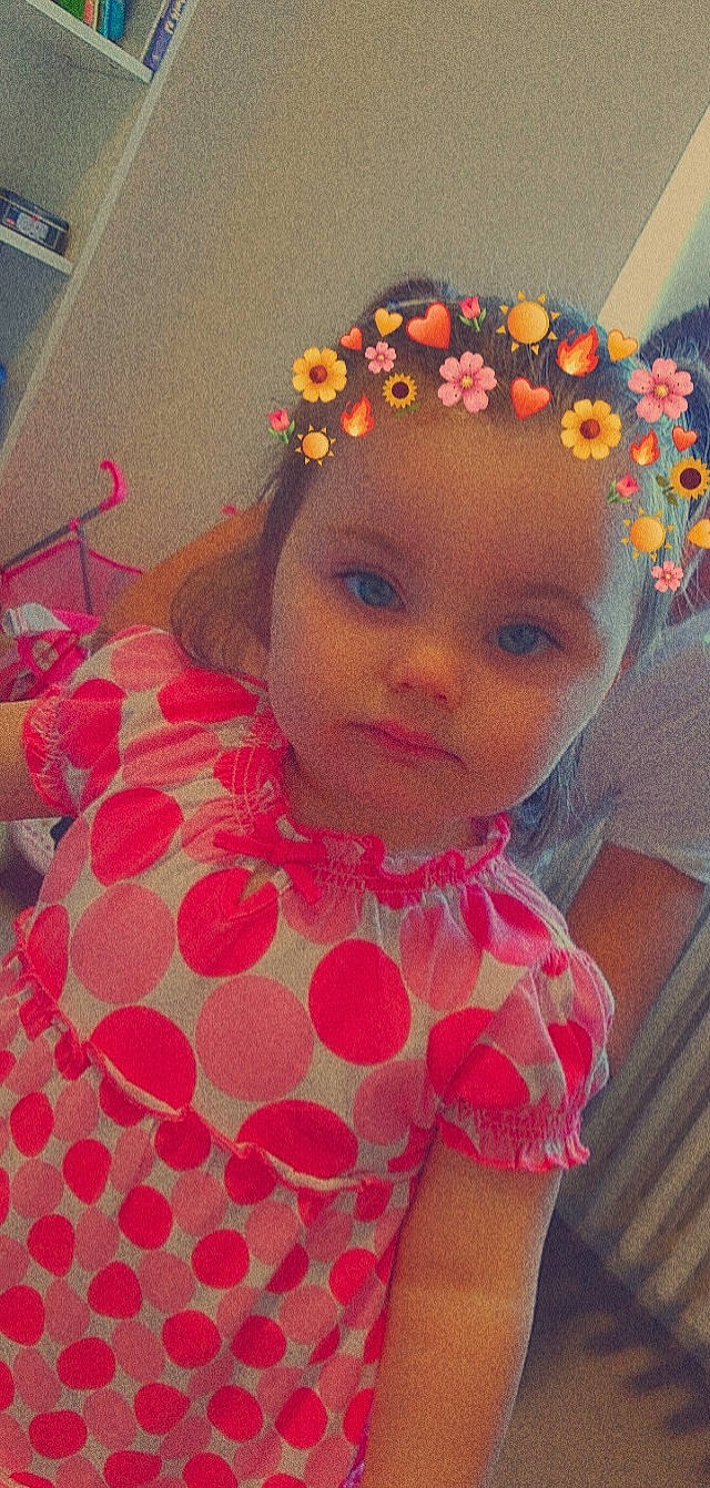 Briana participe au concours pour gagner de l'argent avec cette photo : baby_toddler_clothing, cheek, chin, embellishment, eye, eyebrow, eyelash, flower, hair, head, headgear, headpiece, iris, lip, magenta, neck, person, pink, sleeve, textile