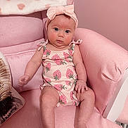 Faith joined the competition — help win amazing prizes! baby, infant, pink, armchair, headband, strawberry_print, blanket, cute, child, sitting, indoors, portrait, clothing, soft_furniture, expression, skin, person, young_child, head, legs
