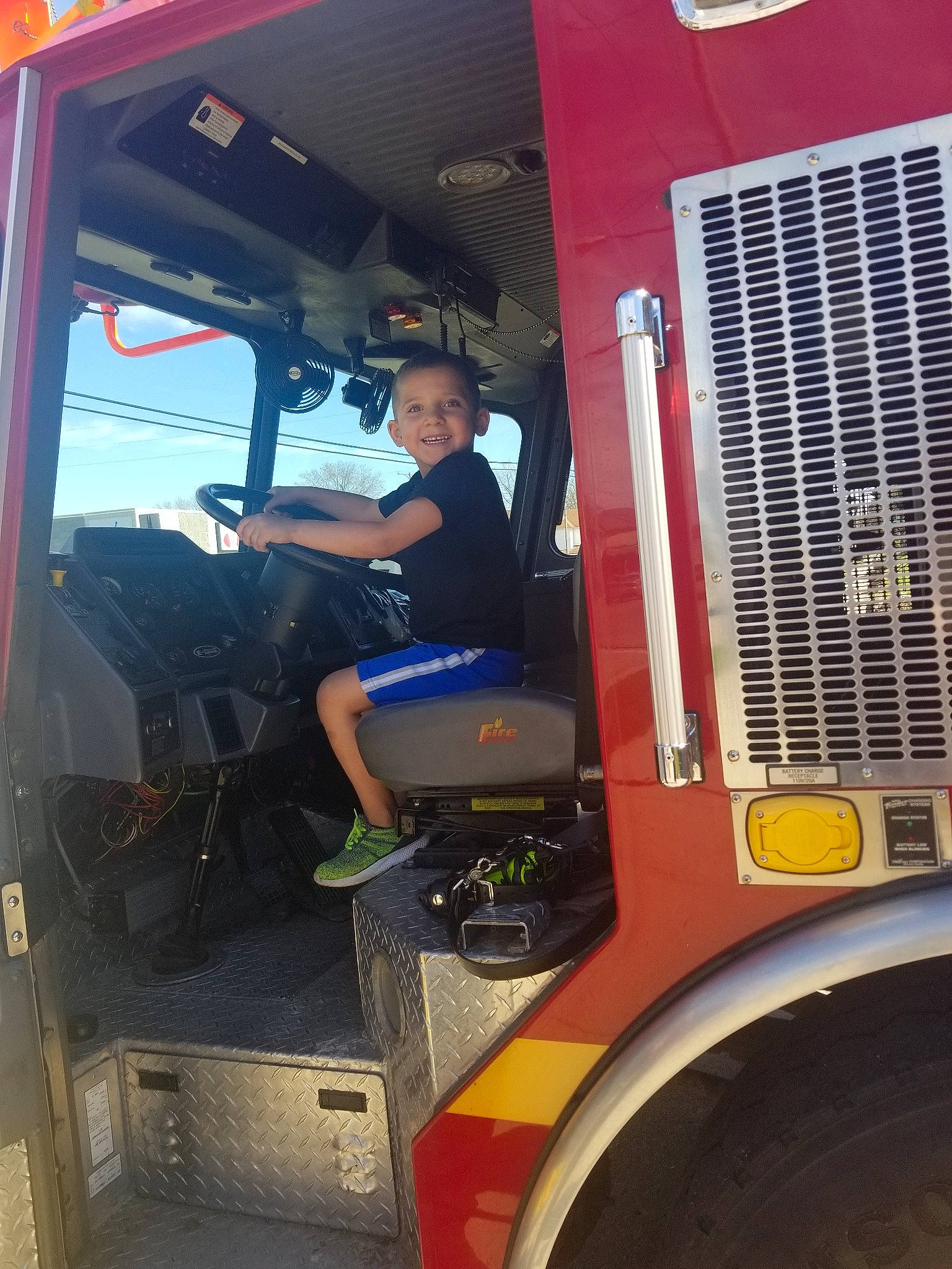 Kegan joined the competition — help win amazing prizes! automotive_window_part, car, fire_apparatus, joy, machine, person, transport, truck_driver, vehicle