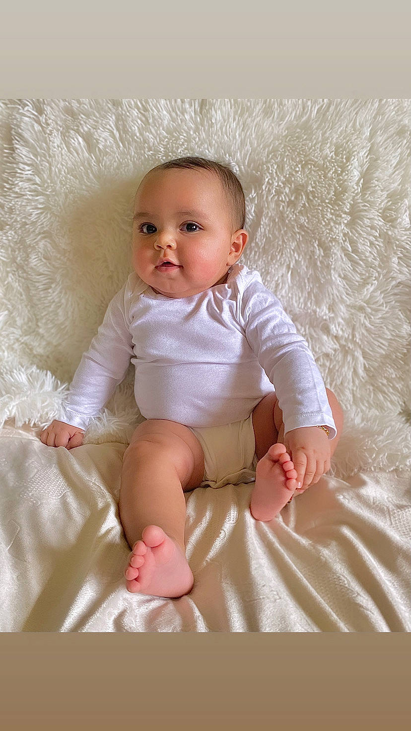 Lunarae joined the competition — help win amazing prizes! baby, baby_toddler_clothing, barefoot, cheek, child, collar, comfort, finger, flash_photography, human_leg, iris, knee, peach, person, pink, shorts, sitting, skin, sleeve, stomach