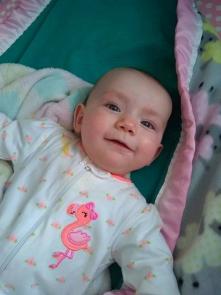 Johanna is registered to the contest to win money with this photo: baby, baby_products, beauty, cheek, child, eye, face, head, iris, linens, lip, nap_mat, person, pink, skin, smile, textile, toddler