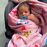 Zanova joined the competition — help win amazing prizes! baby, blanket, car_seat, pacifier, infant, pink, star_pattern, wrapped, cute, indoor, child, face, small_hands, cozy, portrait, newborn, soft, comfort, looking, resting