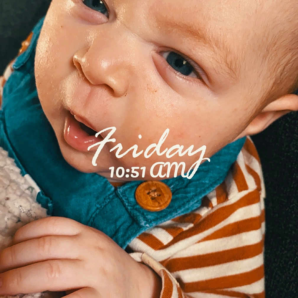 Elias is registered to the contest to win money with this photo: accessories, baby, bodypart, bonnet, clothing, earring, face, finger, frown, hand, happy, hat, head, homedecor, hoodie, jewelry, knitwear, laughing, mouth, newborn