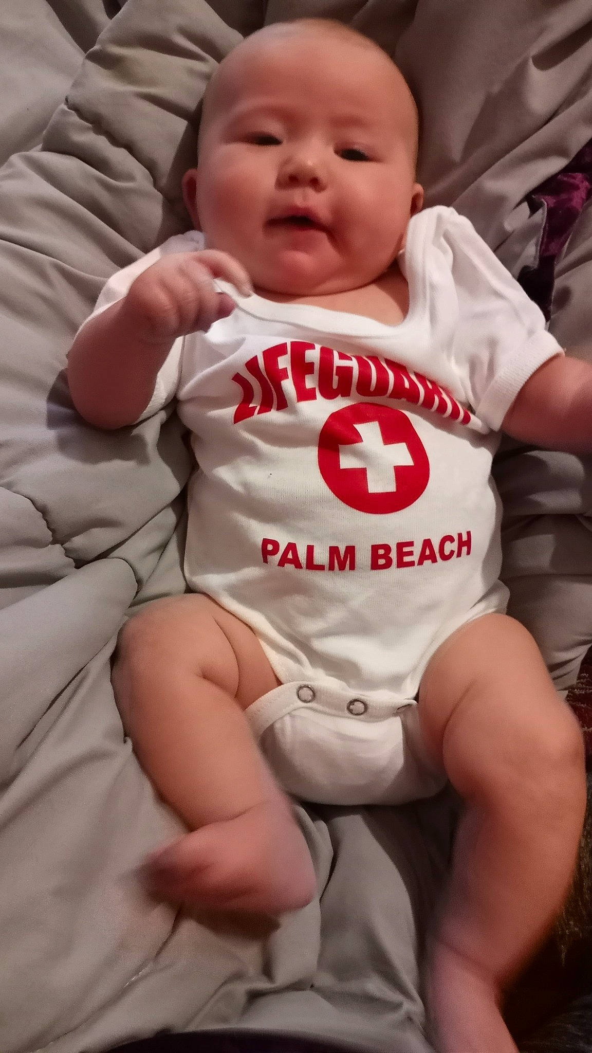 Jasmynn is registered to the contest to win money with this photo: baby_toddler_clothing, cheek, comfort, eye, face, finger, gesture, hand, happy, head, human_body, leg, lip, mouth, neck, nose, person, skin, sleeve, stomach