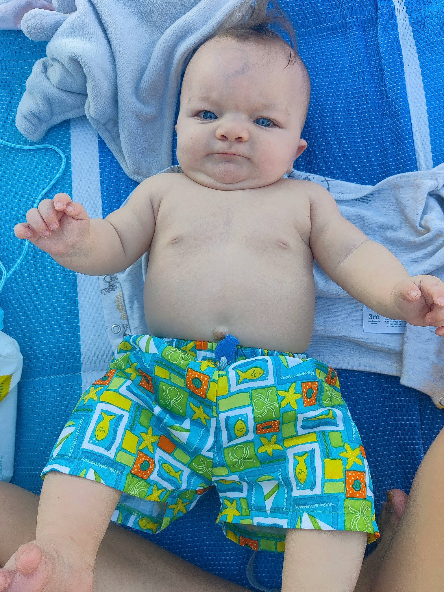 Xane is registered to the contest to win money with this photo: azure, baby, baby_toddler_clothing, blue, facial_expression, finger, happy, mouth, muscle, organ, person, product, skin, sleeve, smile, stomach, textile, thigh, toddler, white