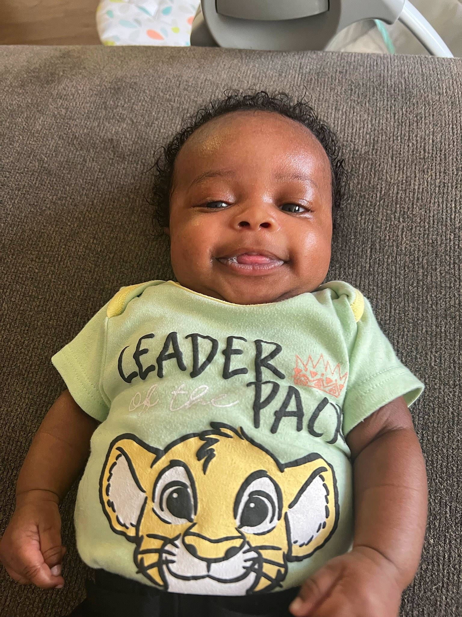 Brent is registered to the contest to win money with this photo: baby, baby_toddler_clothing, cheek, child, chin, comfort, cool, eye, fun, happy, head, joy, linens, mouth, nose, person, sitting, sleeve, smile, t_shirt