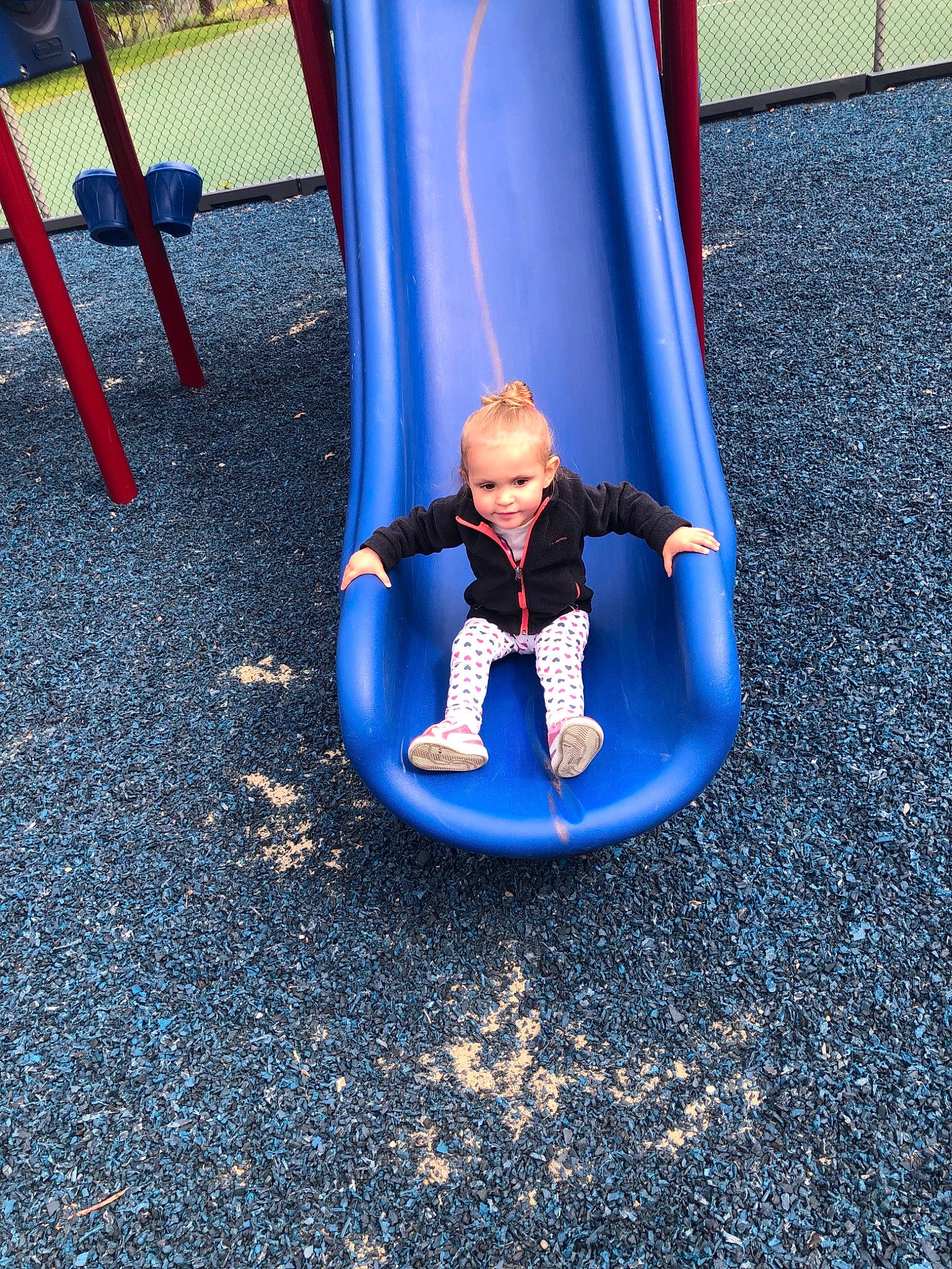 Annelies Victoria  is registered to the contest to win money with this photo: blue, child, city, fun, human_settlement, leisure, outdoor_play_equipment, person, play, playground, playground_slide, public_space, recreation, swing, toddler