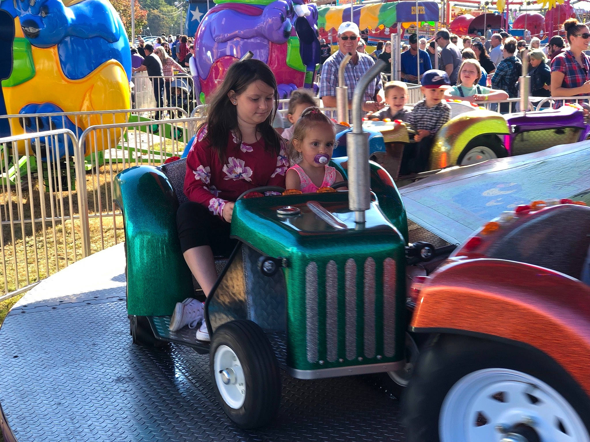 Annelies Victoria  joined the competition — help win amazing prizes! amusement_park, amusement_ride, car, fair, festival, fun, joy, park, person, recreation, tractor, vehicle